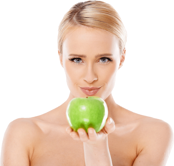 blonde woman holding green apple